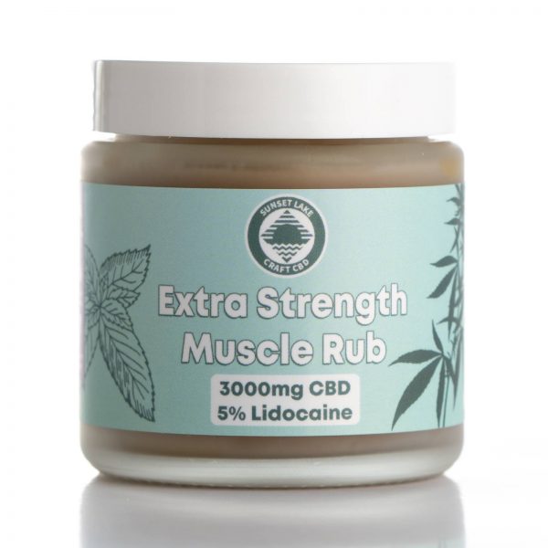 A jar of Extra Strength Muscle Rub with CBD, Lidocaine, menthol, and camphor oil for cooling relief