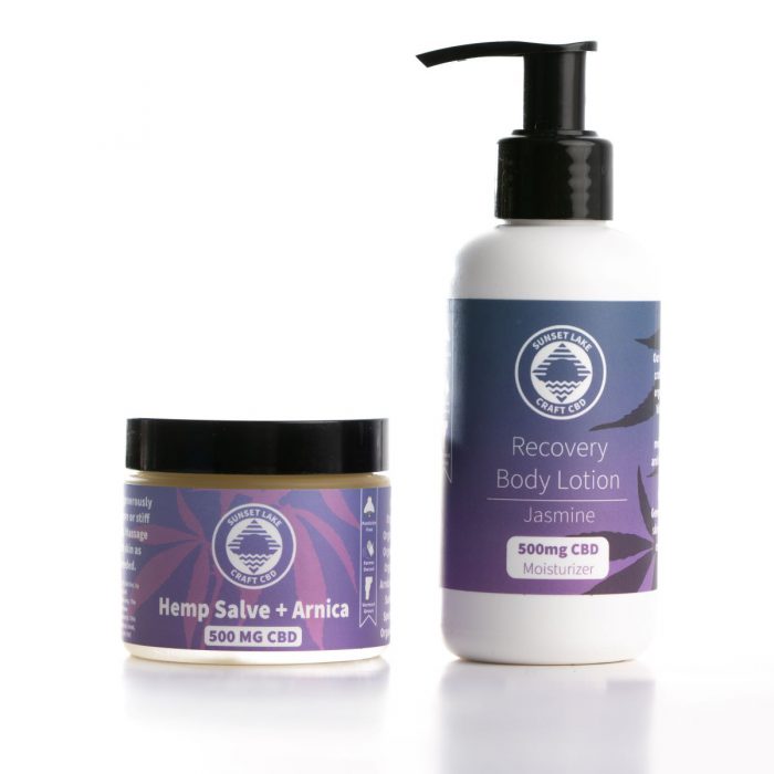 A 500mg full spectrum CBD salve next to a four ounce bottle of Jasmine CBD lotion from Sunset Lake CBD