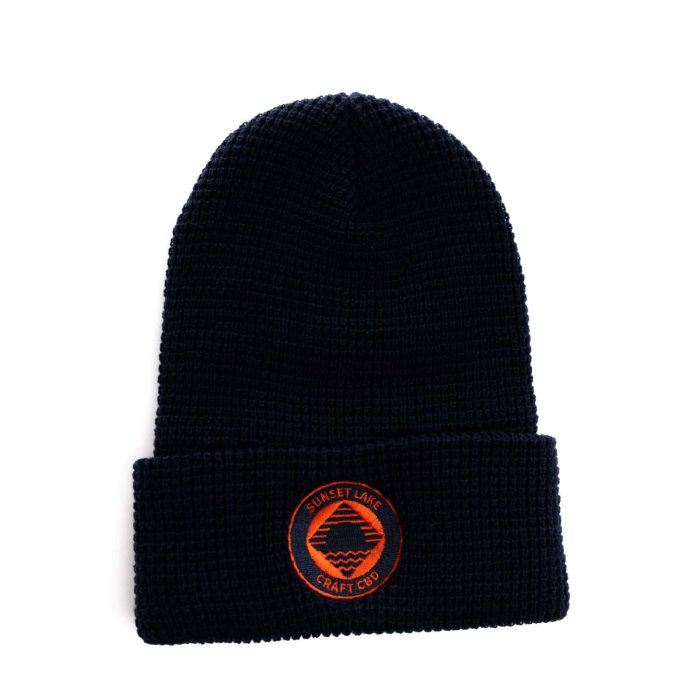 Sunset Lake CBD Beanie. A blue knit cap with the orange Sunset Lake CBD logo