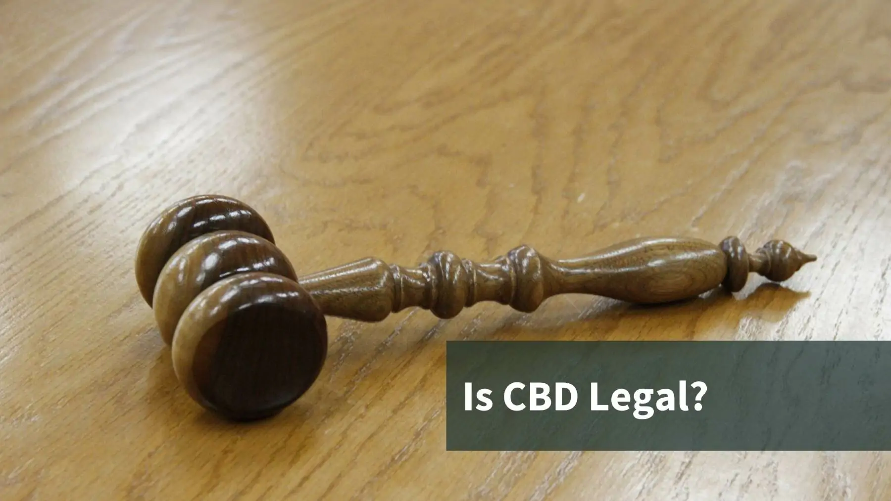 A gavel with the text that reads "Is CBD Legal?"