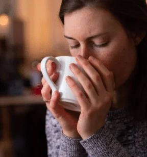 A woman drinking cannabinoid infused tea