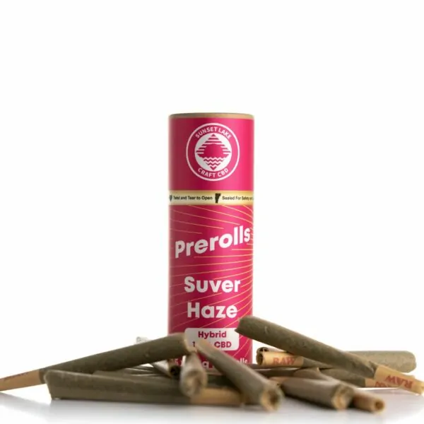 A tube of Suver Haze Prerolls surrounded by pre-rolled joints