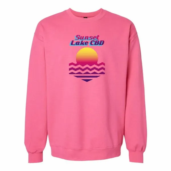 A pink crewneck with a retro Sunset Lake CBD logo on the chest