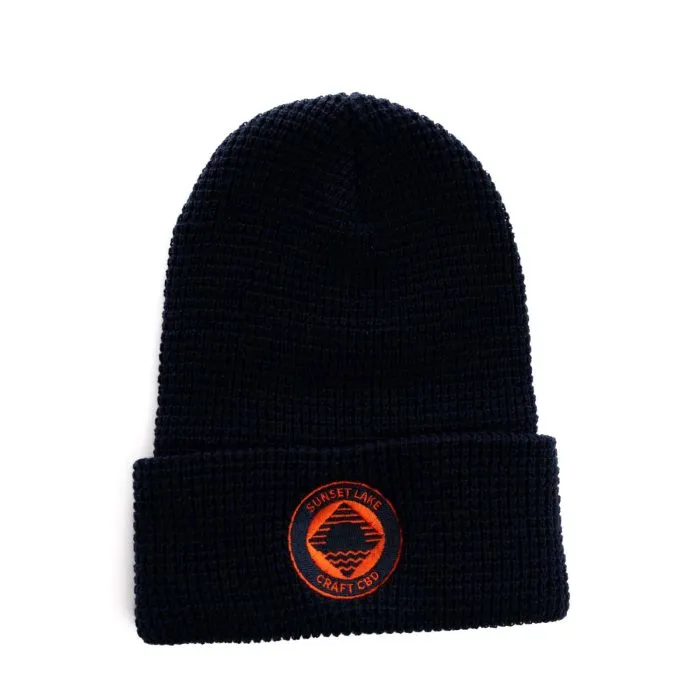 Sunset Lake CBD Beanie. A blue knit cap with the orange Sunset Lake CBD logo