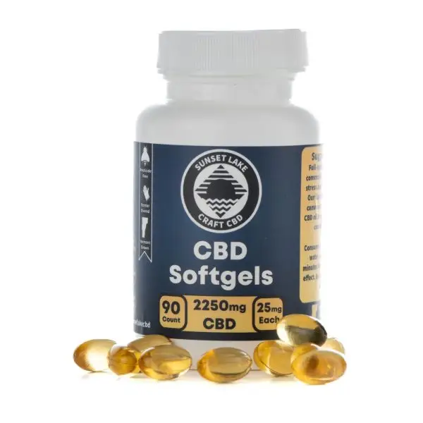 A 90-count bottle of CBD Softgels surrounded by loose softgel caps